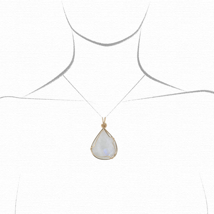 moonstone pendant on a chalk drawing of a model to show relative size