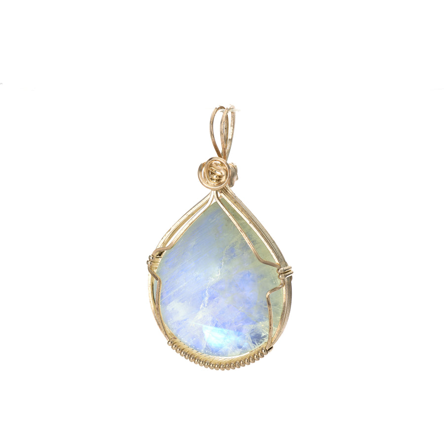Gold pendant with a teardrop-shaped blue gemstone on a white background
