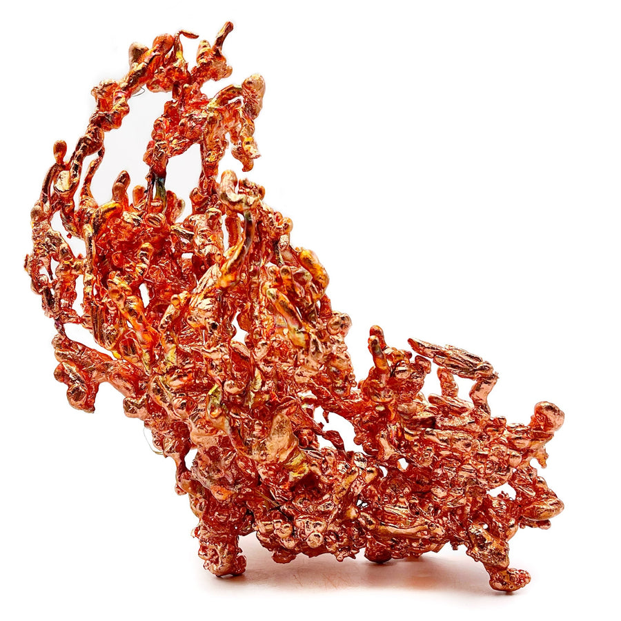 Cluster of red-orange copper crystals on a white background