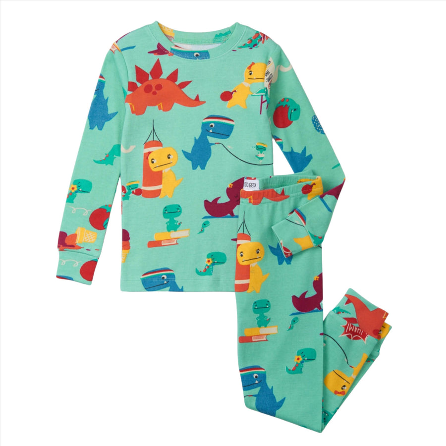 cartoon images of Tiny T. rex and friends are seen exercising, reading, and having fun against a teal blue background. The pajama set has a long sleeve top and pajama pant bottoms with an elastic waistband and cuffs.