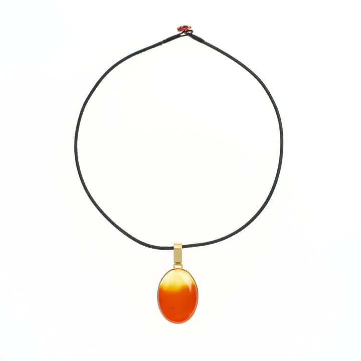 Amber pendant on cord necklace