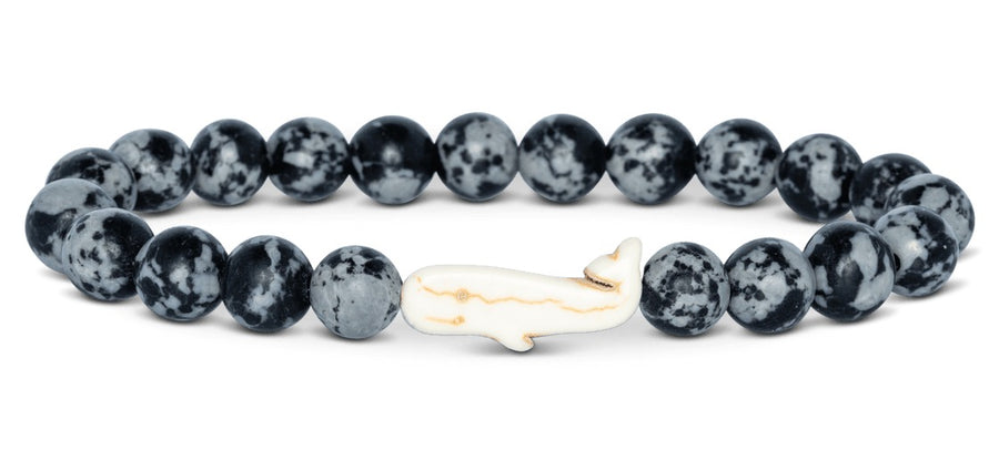 black and grey beaded bracelet with a whale bead on white background