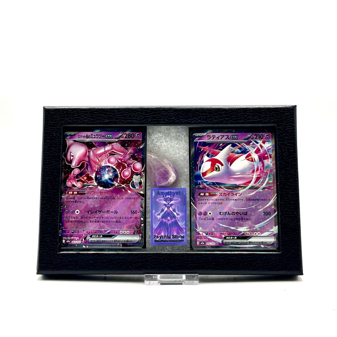 Two Japanese Pokemon trading cards featuring Mewtwo and Latias in a black display case on a white background