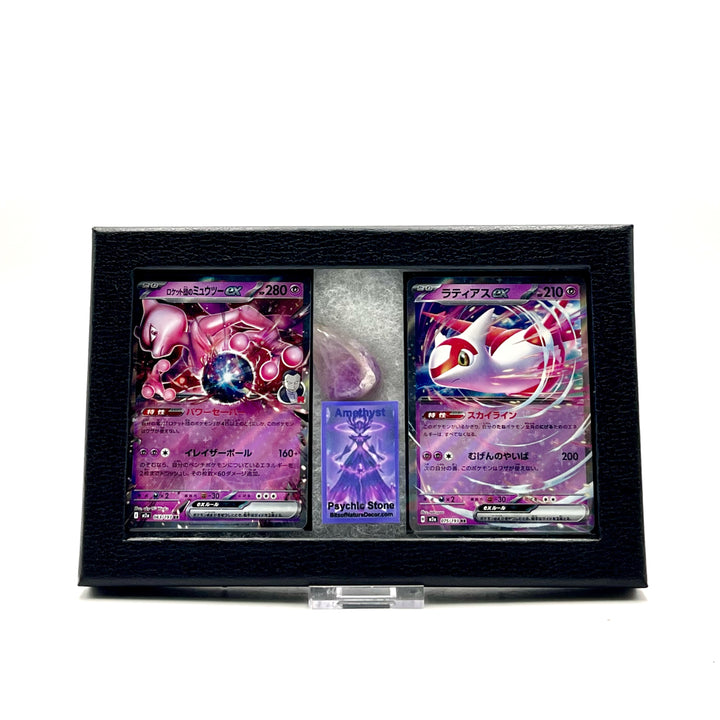 Two Japanese Pokemon trading cards featuring Mewtwo and Latias in a black display case on a white background