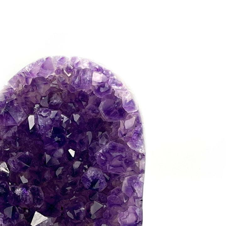 close up of amethyst heart carving gem