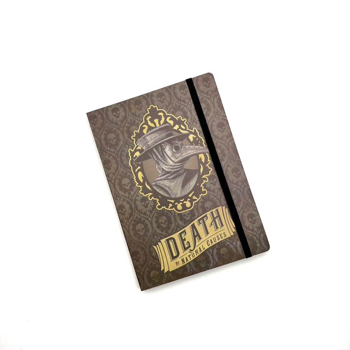 black softbound journal with plague doctor graphic and exhibit name "Death by Natural Causes" on the cover, against a white background