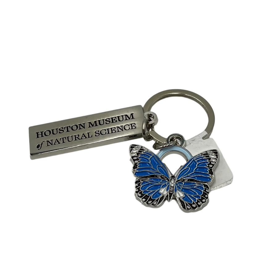 A blue butterfly charm keychain with a metal tag that reads 'Houston Museum of Natural Science.'