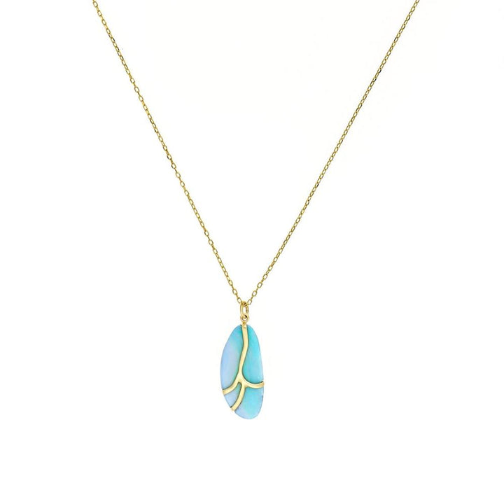 blue opal with 18k gold pendant on a chain necklace