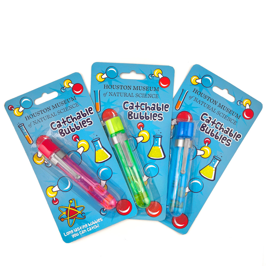 Three packages of Houston Museum of Natural Science Catchable Bubbles on a white background