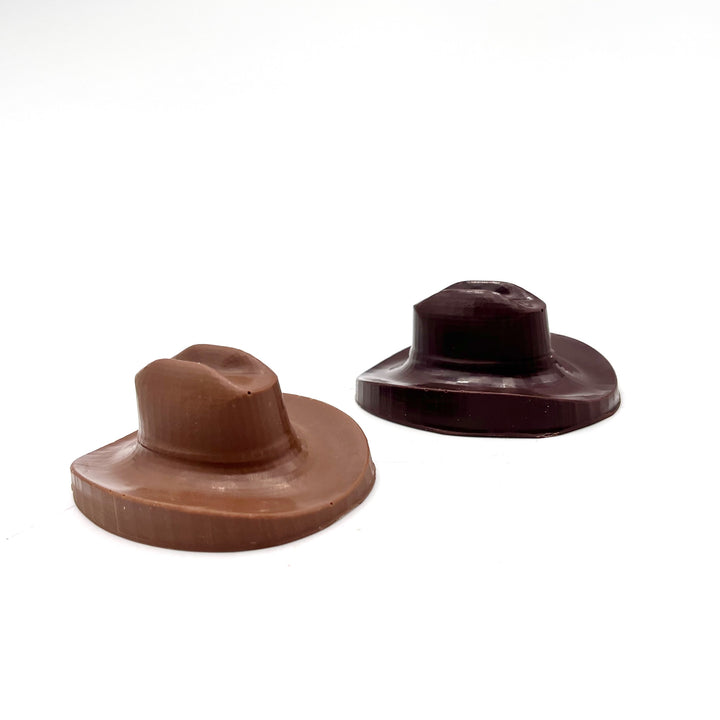 Two chocolate hats on a white background