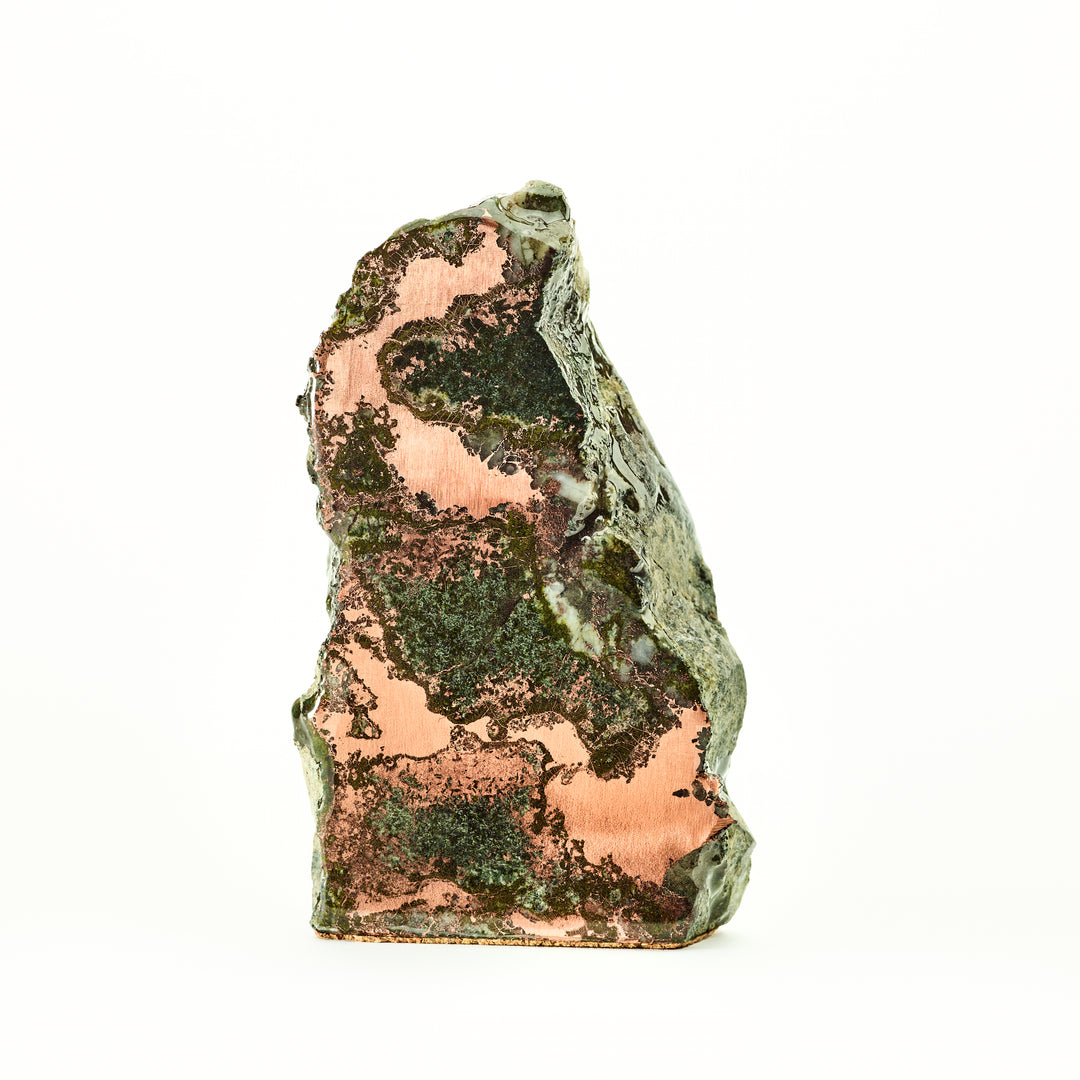 copper ore with green patina on a white background