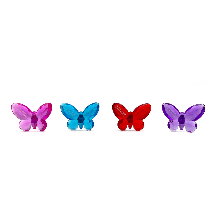 Four colorful butterfly-shaped objects on a white background