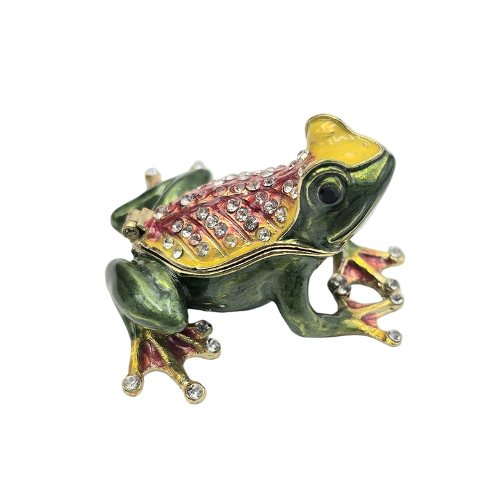 Decorative frog figurine with gemstones on a white background