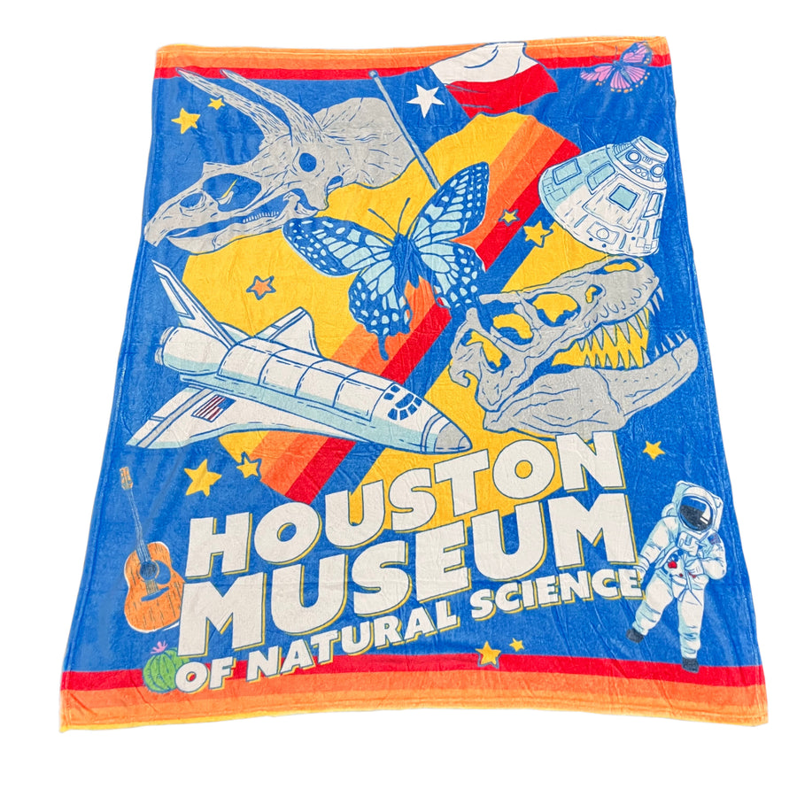 fleece blanket with Houston Museum of Natural Science graphics on a white background