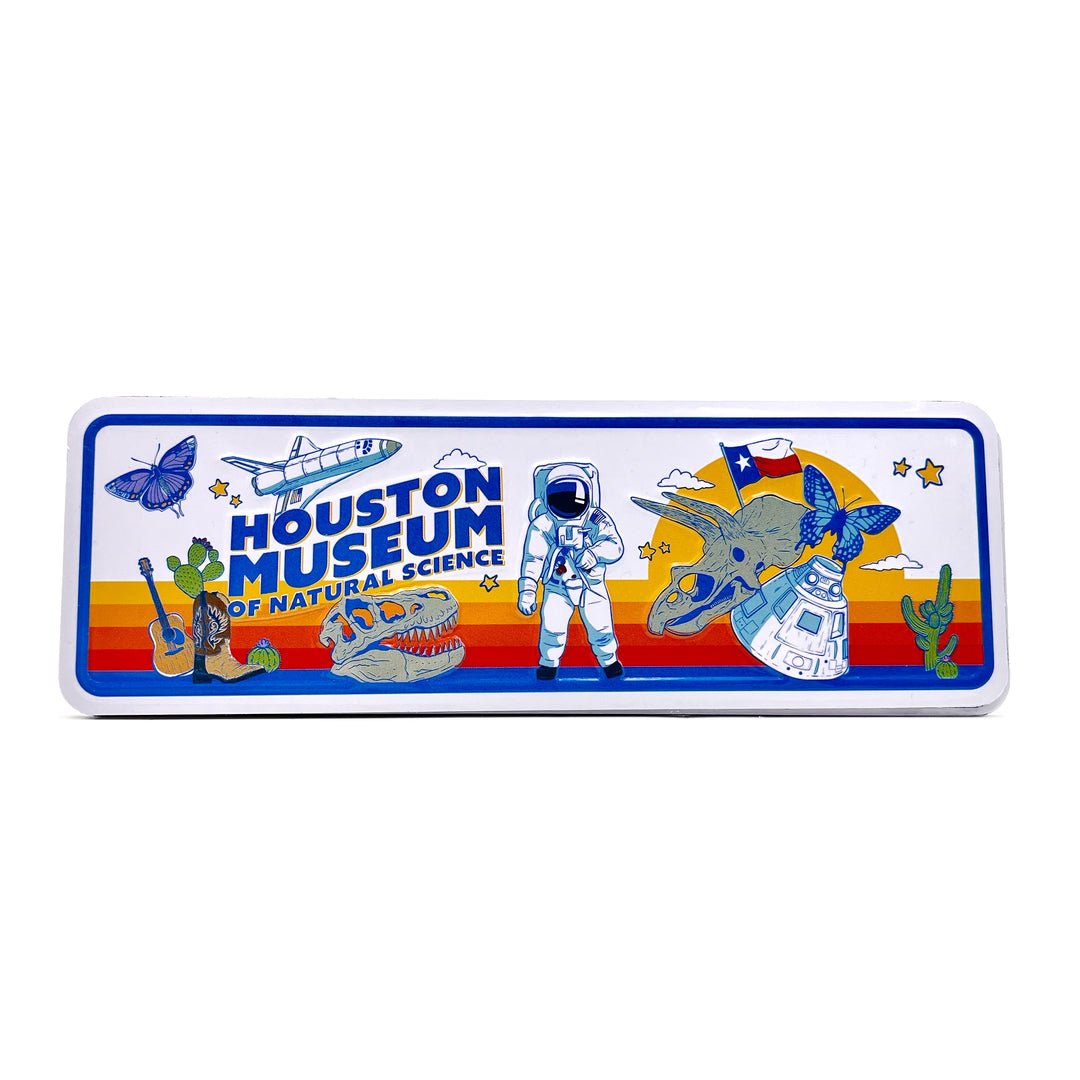 Rectangular magnet with Houston Museum of Natural Science design featuring an astronaut, dinosaur, and other elements on a white background.