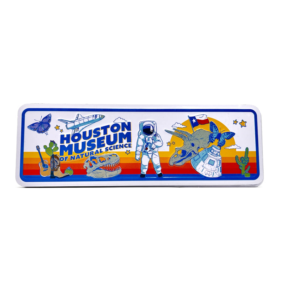 Rectangular magnet with Houston Museum of Natural Science design featuring an astronaut, dinosaur, and other elements on a white background.