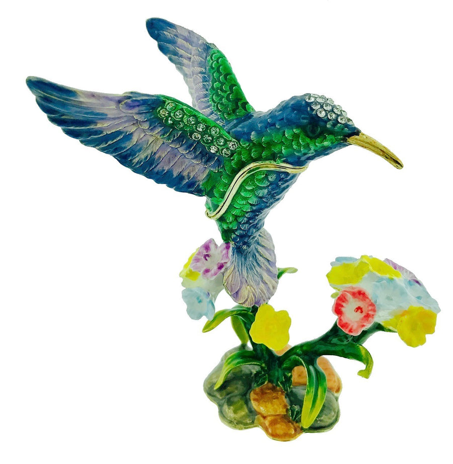 Colorful hummingbird figurine with flowers on a white background