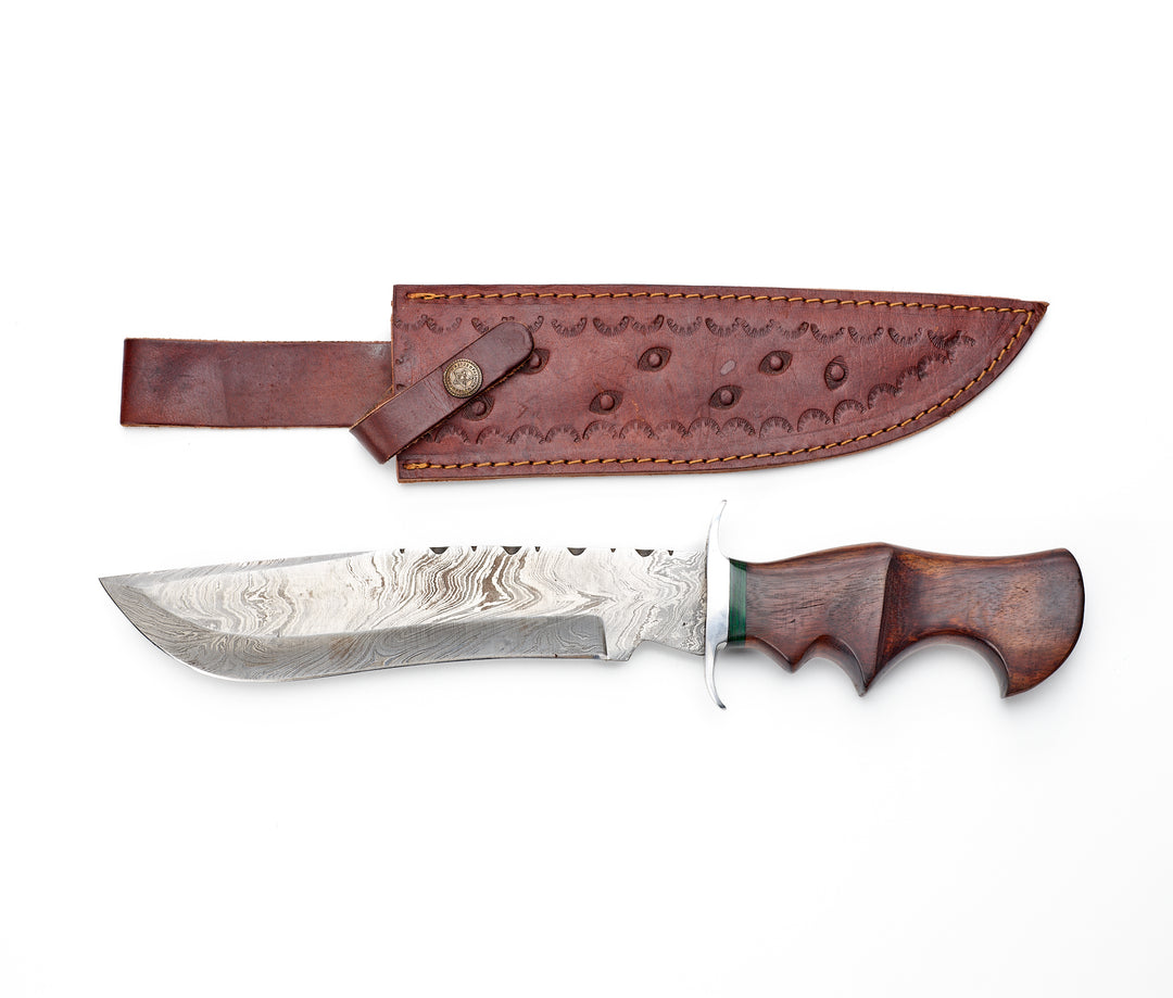A Damascus Bowie knife with a wooden handle and a brown leather sheath, displaying the blade and the handle against a white background.