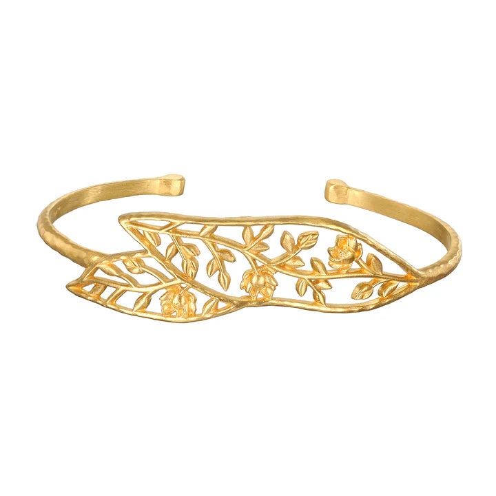 A gold-colored open leaf cuff bracelet with an 18kt gold plating, featuring an open-work design with lotus flowers.