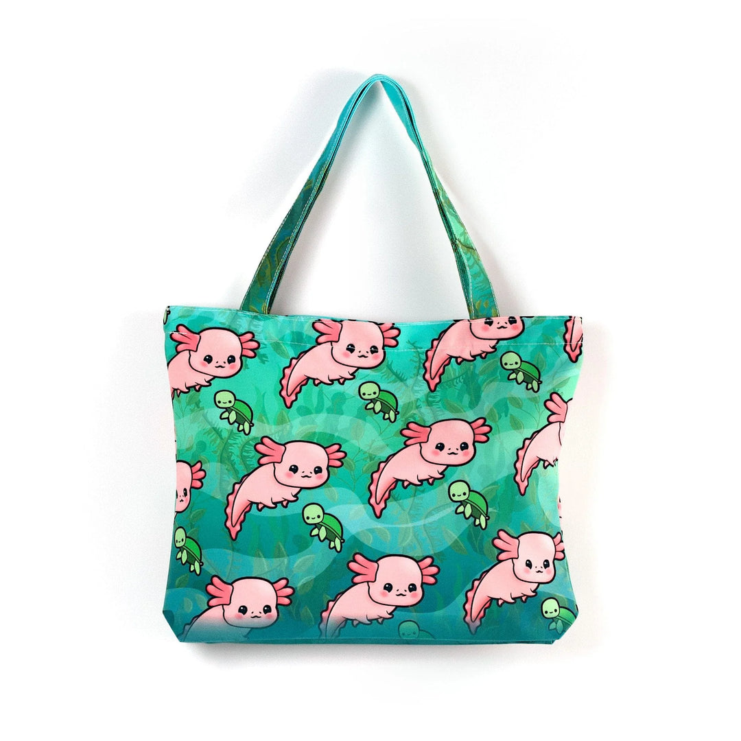 Pink axolotls with small green sea turtles on a teal background tote bag