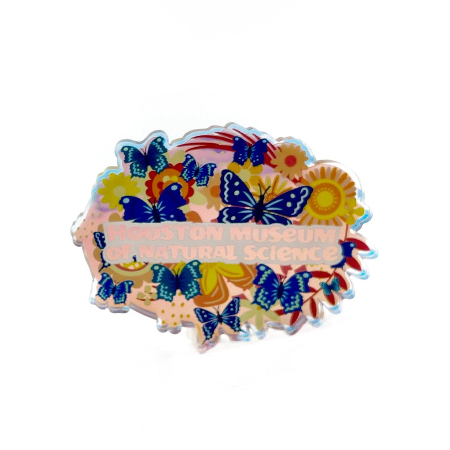 iridescent magnet with butterflies and flowers on a white background