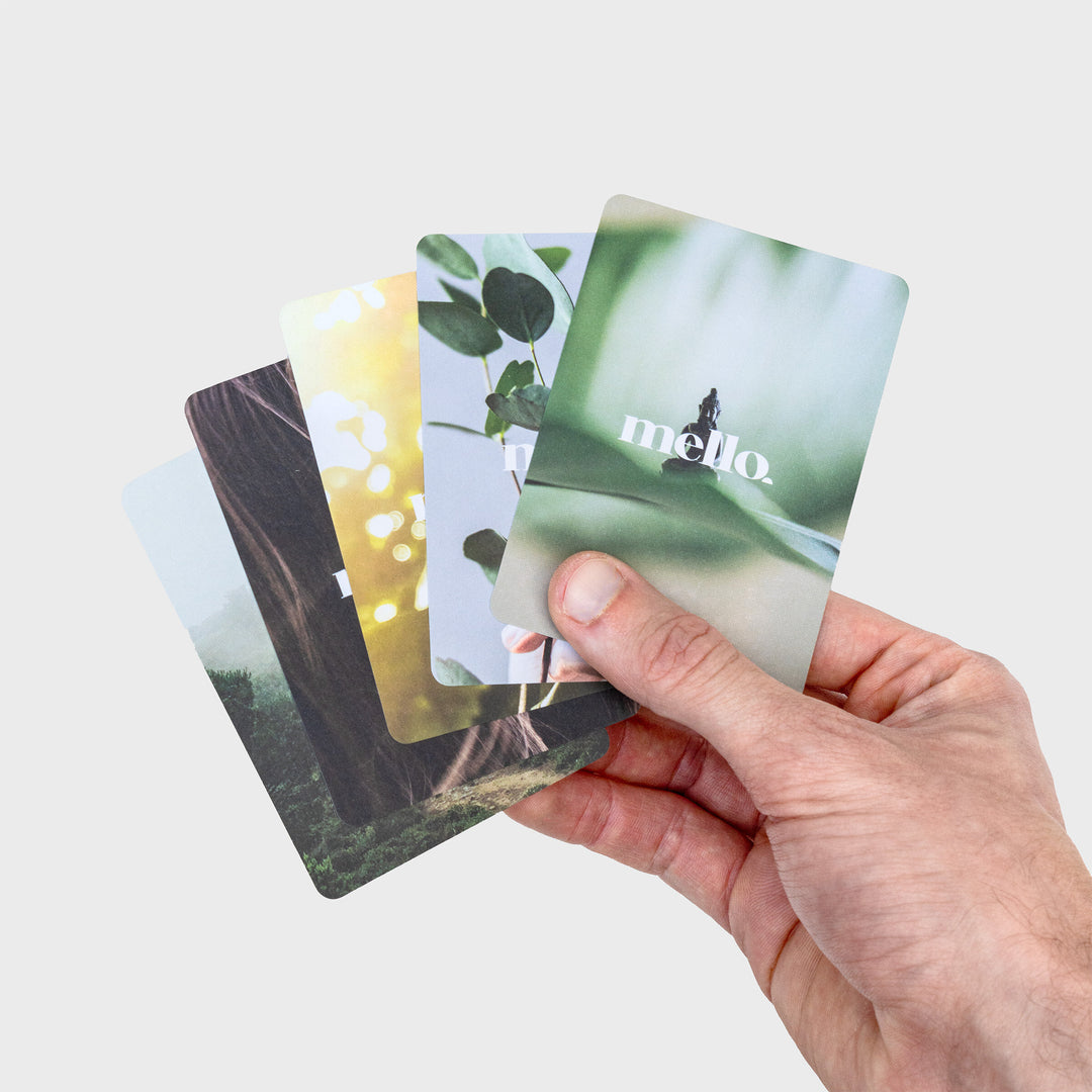 several cards from the deck with soothing nature-inspired backs