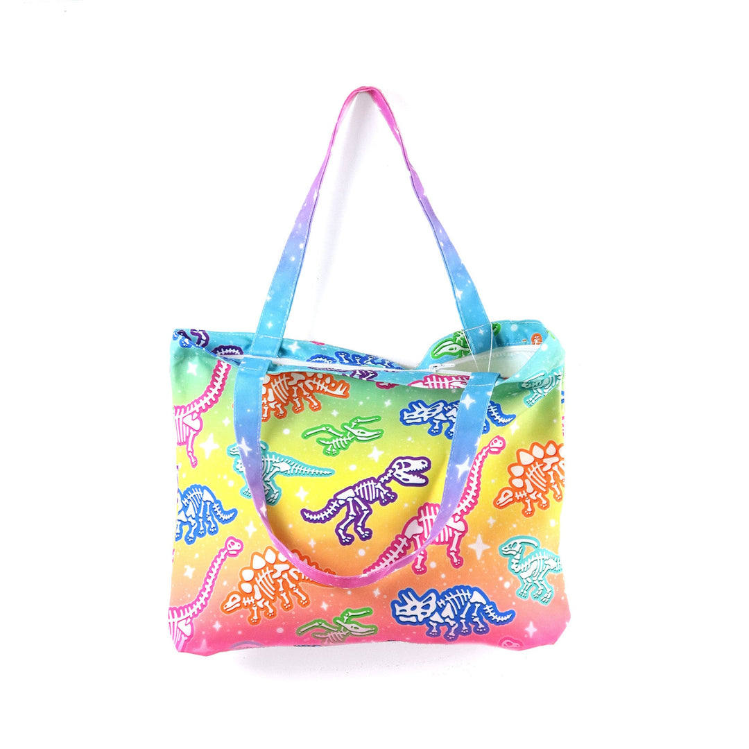 Colorful tote bag with dinosaur design on a white background