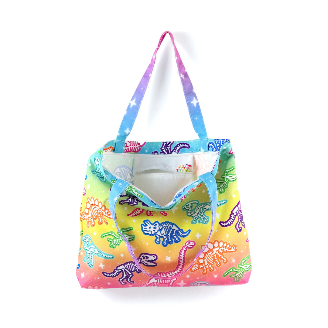 Colorful tote bag with dinosaur pattern on a white background