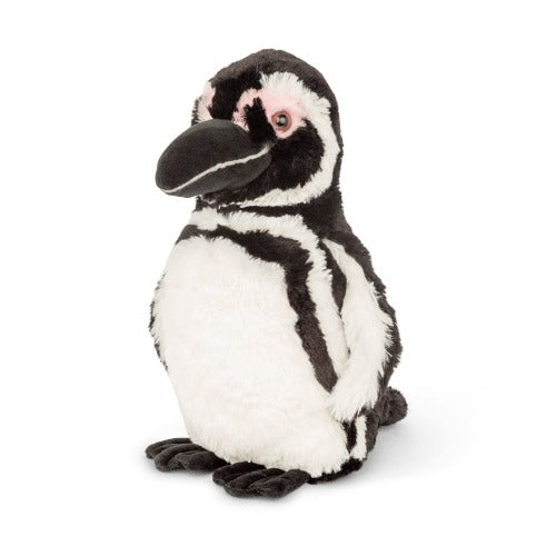 black and white penguin plush toy on white background