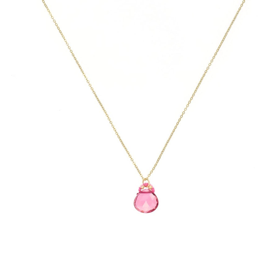 faceted pink quartz pendant hangs from a pink silk cord bail on a gold chain