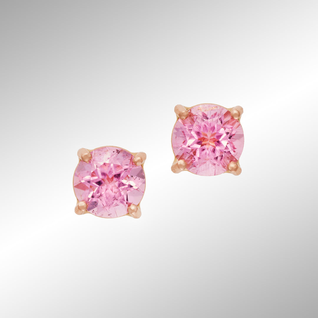 Pair of pink gemstone earrings on a light gray background