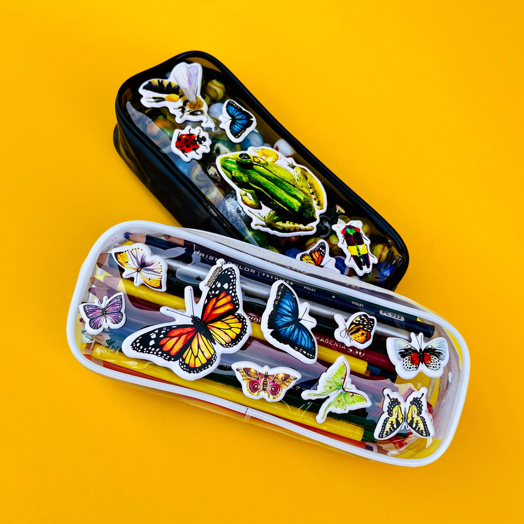 Two cases with colorful butterfly stickers on a yellow background