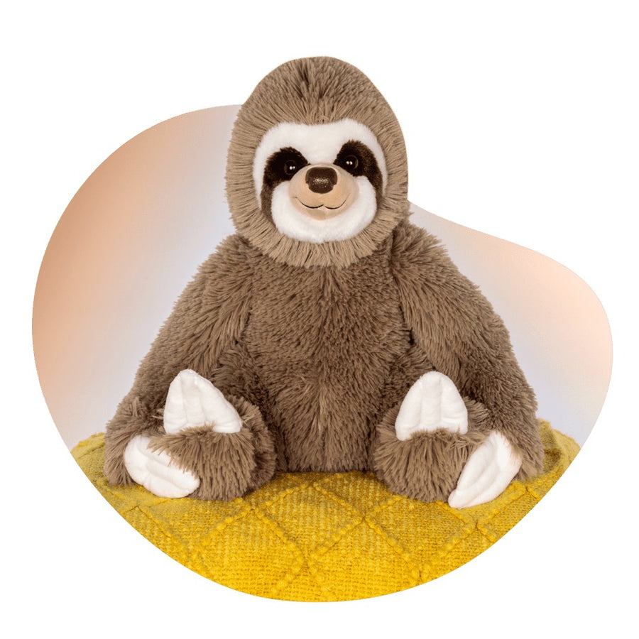 brown sloth plush sits on a yellow cushion