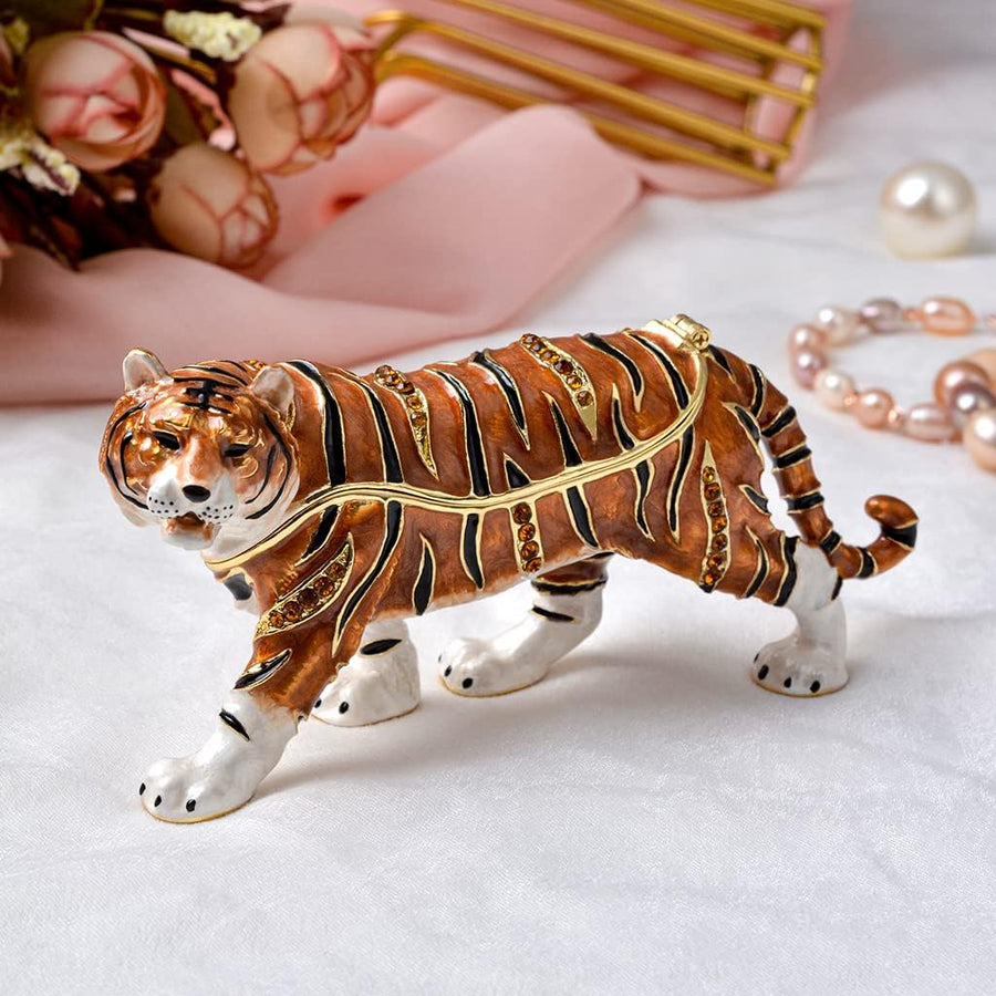 Decorative tiger figurine with jewelry on a white background