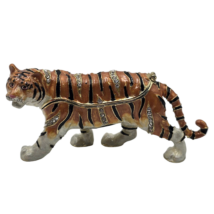 Decorative tiger figurine with jewelry on a white background