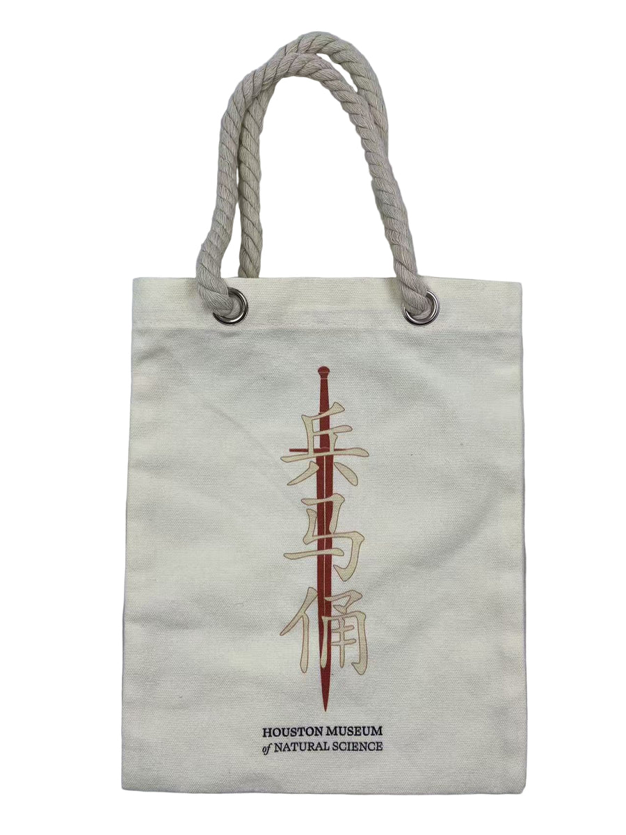 Canvas tote bag with rope handles and a design of a sword and Chinese characters, featuring the Houston Museum of Natural Science.