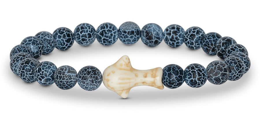 A navy blue and white beaded bracelet featuring a white and orange whale shark bead on white background